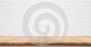 Empty wooden table top, counter or shelf on white brick wall photo