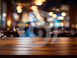 Empty wooden table top with lights bokeh on blur restaurant background.