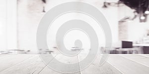 Empty wooden table top with out of focus lights bokeh modern white coffee shop background