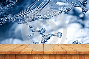Empty wooden table and water drop