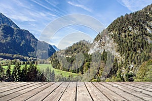 Empty wooden terrace with Austria national park view