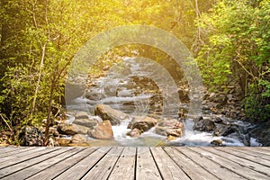 Empty wooden terrace with Stream in forest