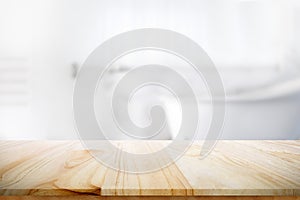 Empty wooden top table with blurred bathroom background