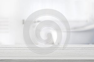 Empty wooden top table with blurred bathroom background