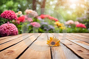 Empty wooden vintage table board on spring flower garden bokeh background.