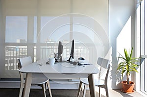 An empty working desk for two in home office