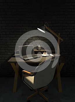 An empty workplace at night with office desk, armchair and laptop in a dark room lit by the light of a desk lamp. Sitting at the