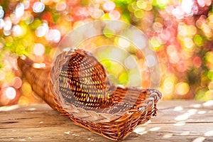 Empty woven basket on the wooden table