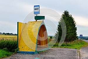 Empty yellow  bus stop