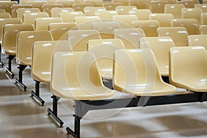 Empty yellow plastic chairs