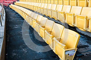 Empty yellow seats at stadium,Rows walkway of seat on a soccer stadium