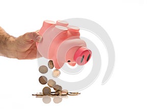 Emptying piggy bank with euro`s
