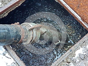 Emptying the septic tank with a sewage cleaner machinery