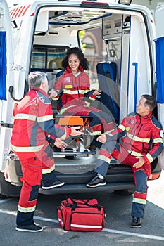 EMS workers in the red uniforms involved in a conversation