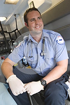 EMT Doctor Sitting In Ambulance photo