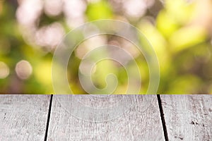 Emtry wooden table on top over blur natural background, can be used mock up for montage products display or design layout