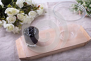 Emty plastic cups for bubble tea on a wooden plate