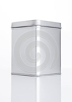 Emty tea steel container jar on white background