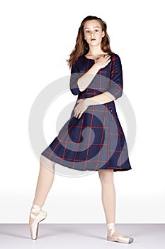 En Points static forward position covering body blue tartan dress Metaphor for hand off