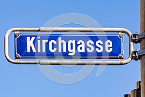 enamel street name sign Kirchgasse - engl: cherry path - in Wiesbaden, Germany