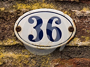 Enameled old house number 36