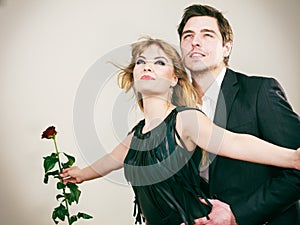 Enamoured couple in titanic gesture.