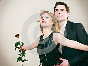 Enamoured couple in titanic gesture.