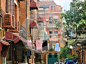 Enchanting corner of Shanghai city, China. Houses, hanging clothes and fascination