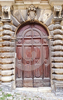 Enchanting door and historical building in Fermo town, Marche region, Italy
