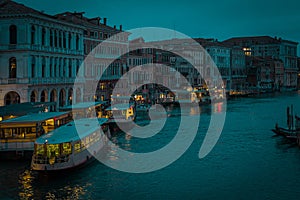 Enchanting venice in night time or evening light during blue hour. Canal in venice with no traffic, calm during a rainy season