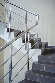 Enclosure with metallic stair railing