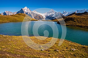 Encountering Bachalpsee when hiking First to Grindelwald Bernese Alps, Switzerland.