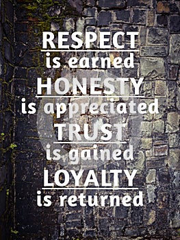 Encouragement quote of respect is earned honesty is appreciated trust is gained loyalty is returned. Text with stones background. photo
