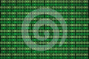 Encrypted binary ASCII computer code on black background. Green binary code computer photo