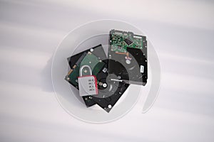 Encrypted hard disk. Padlock with cipher on an opened hard disk. Data loss. computer motherboard. the concept of data