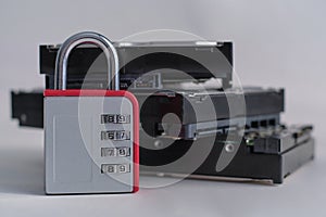 Encrypted hard disk. Padlock with cipher on an opened hard disk. Data loss. computer motherboard. the concept of data