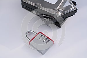 Encrypted hard disk. Padlock with cipher on an opened hard disk. Data loss. computer motherboard. the concept of data