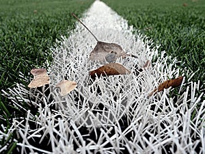 End of football season. Plastic green football turf