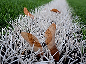 End of football season. Plastic green football turf