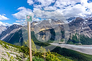 End of hiking trail warning sign in the Canadian Rockies