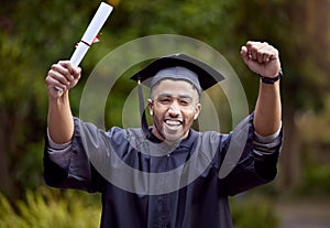 In the end, its all worth it. Shot of a young man looking cheerful on graduation day.