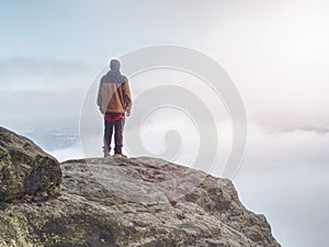 End of misty road in mountains. Boy stay suddenly on edge