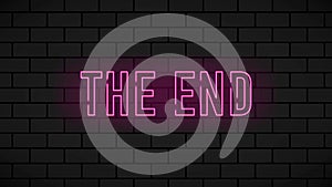 The end red neon sign. Vintage movie ending neon frame on black brick background. Motion graphic.