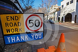 End road work 50 KM/H speed limited zone safety warning sign photo