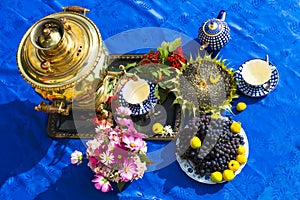 The end of the summer. Samovar, cups of tea, flowers