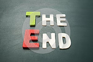 The End text on blackboard