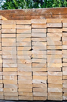 End view of a stack of lumber, materials for building a new house