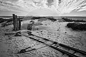 End of the way. Fonte da Telha. Portugal. Atlantic Ocean. Coastline. Black and white. B&W. Railway. Sand dunes. photo