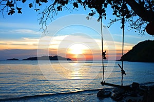 End of the year , Beautiful lighting landscape and cloud before sunset , Wooden swing under the tree