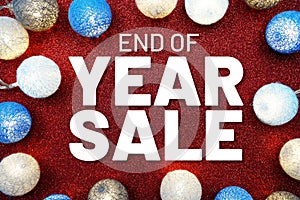 End of Year Sale text and LED cotton Balls Decoration on red Glitter background